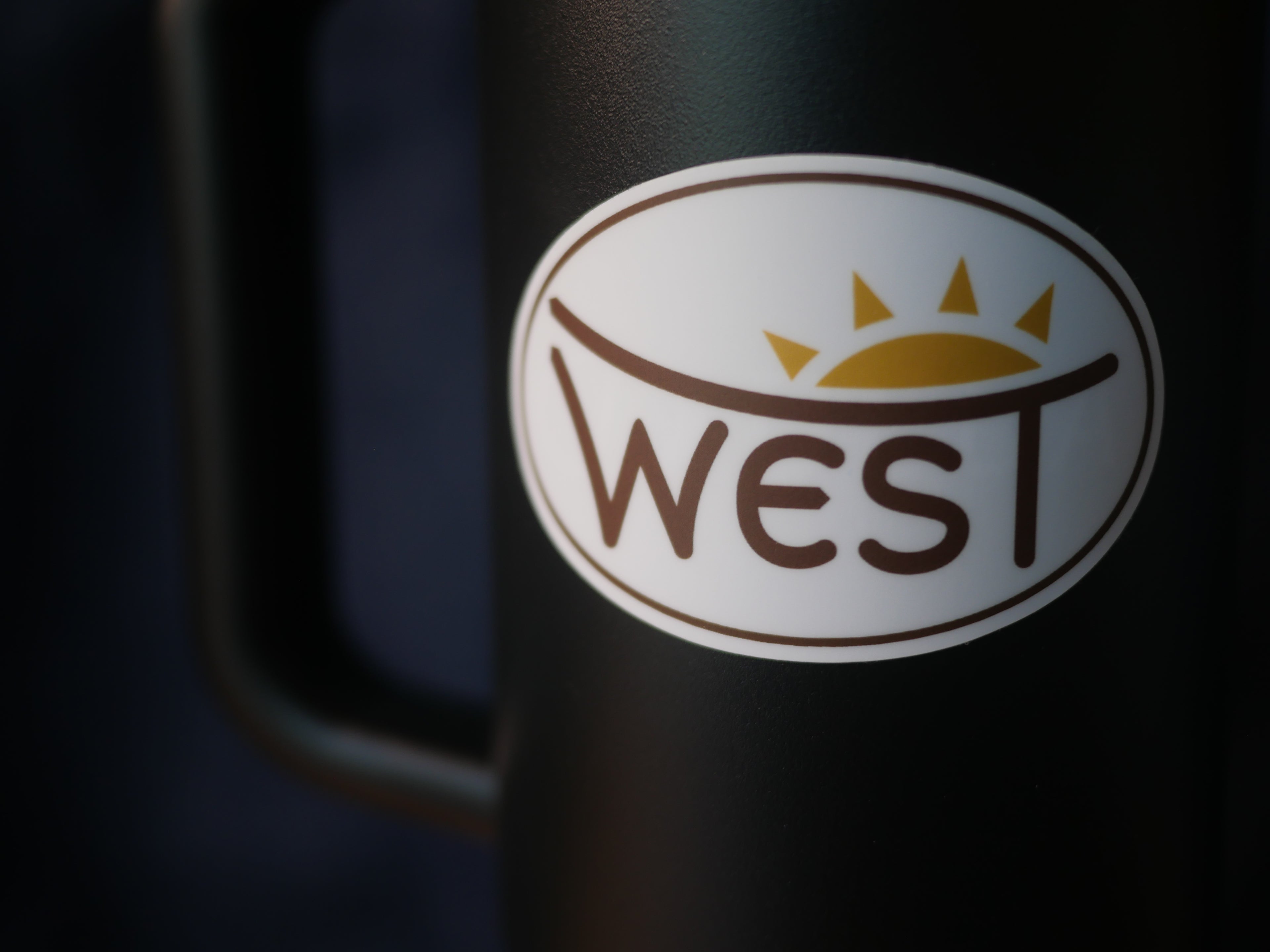 Sunburst WEST premium vinyl sticker